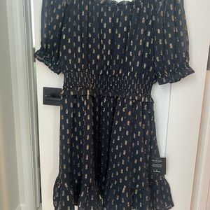 Lulu’s Touch of Glam Navy Blue Dotted Off-the-
Shoulder Mini Dress